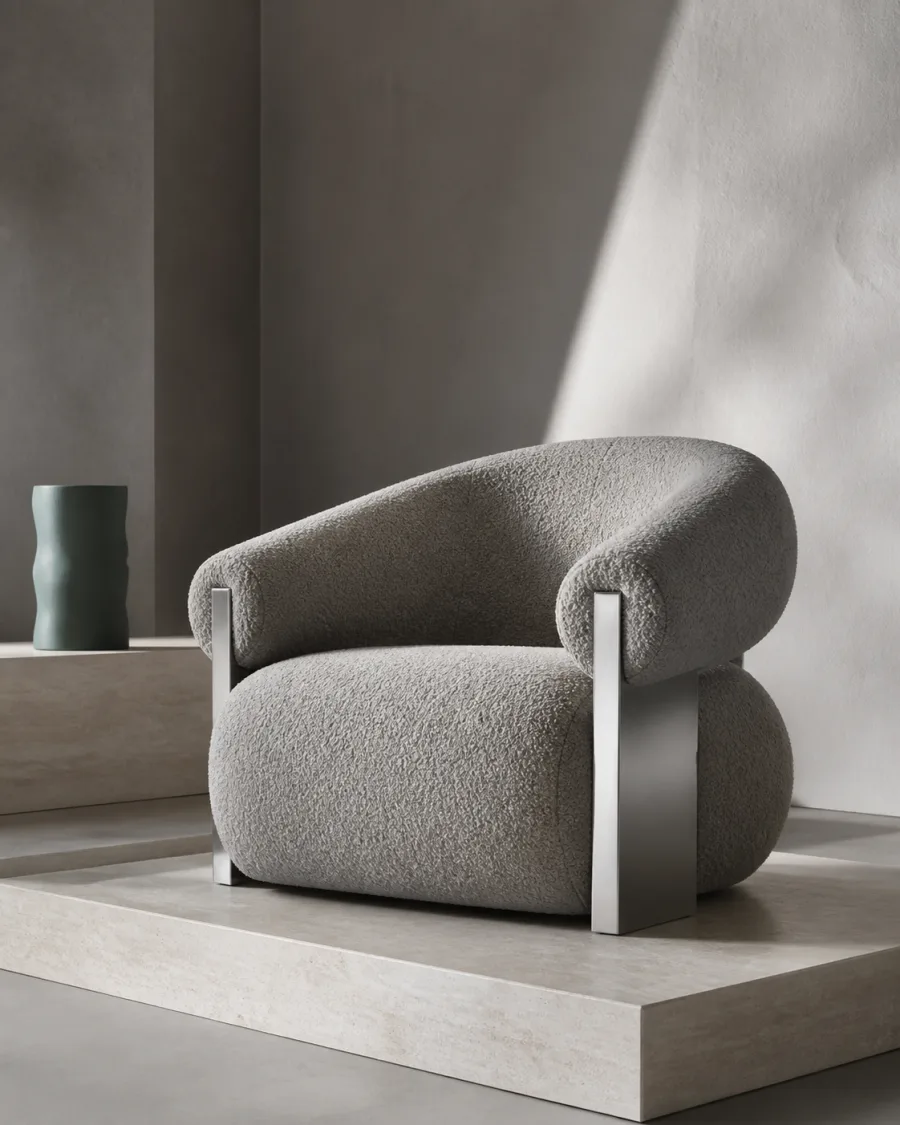 Textured lounge chair with brushed metal supports