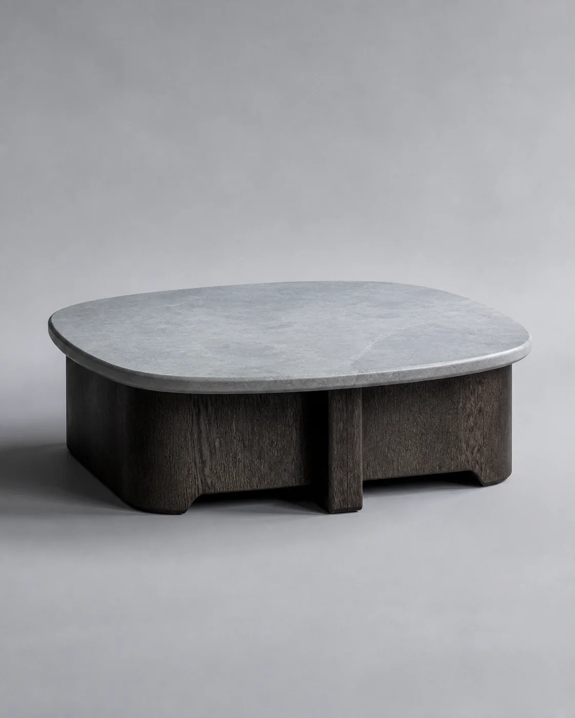 Low smoked oak table with a pale stone top
