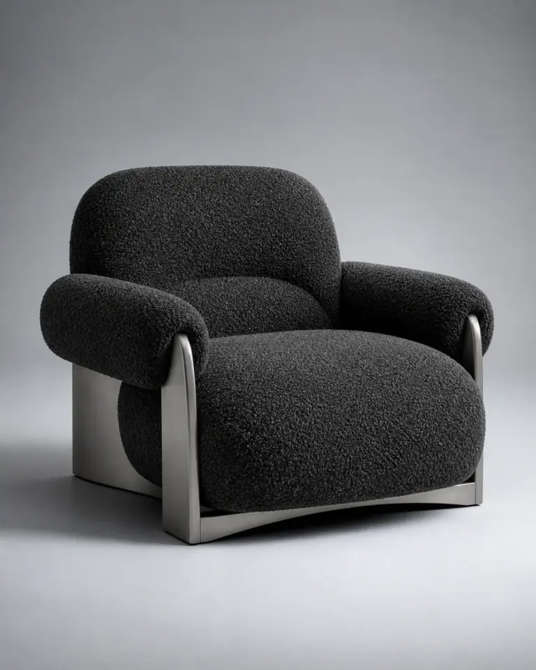Charcoal boucle lounge chair with brushed metal supports